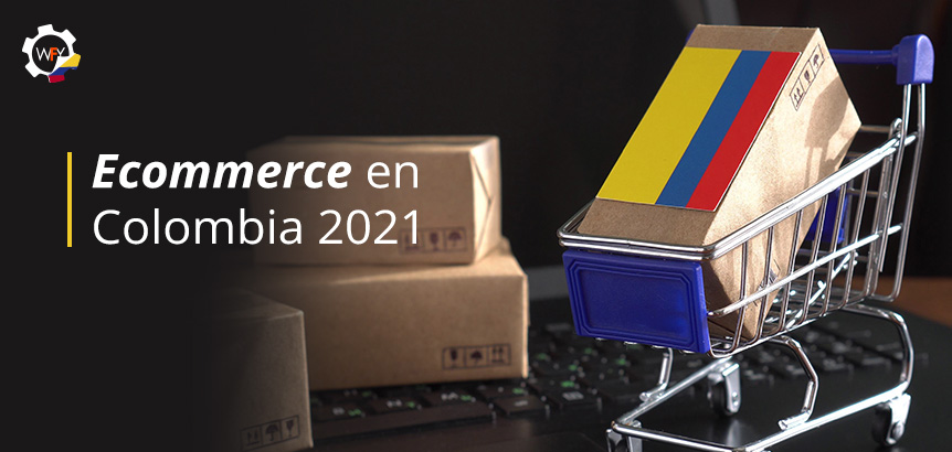Carrito de Ecommerce con Caja y Bandera de Colombia Sobre Teclado de Laptop